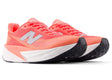 New Balance Women's FuelCell Rebel V5 responsive training shoe for runners in urgent red, white, and metallic silver