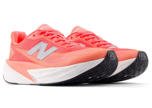 New Balance Women's FuelCell Rebel V5 responsive training shoe for runners in urgent red, white, and metallic silver