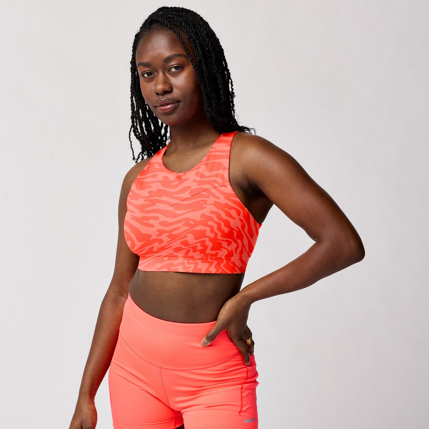 Brooks 3 Pocket Sports Bra with medium compressive support and storage pockets
