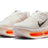Nike Men's Vomero Premium maximum cushioning road running shoe in white and orange